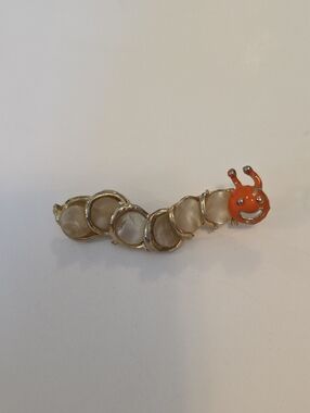 Gold-Tone Mother-of-Pearl Cabachon Caterpillar Brooch with Orange Head 80's